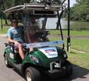 Photo of autonomous golf cart.